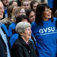 President Philomena V. Mantella standing with Robert and Ellen Thompson and a group of Thompson Scholars.
